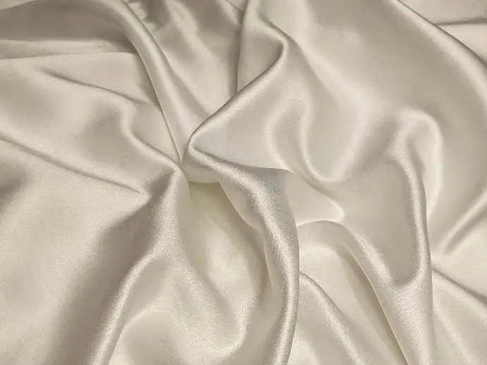 white textile on brown wooden table